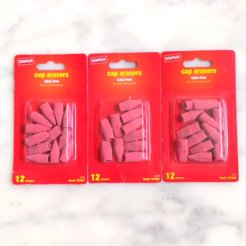 NWT. Staples Pack of three cap erasers.